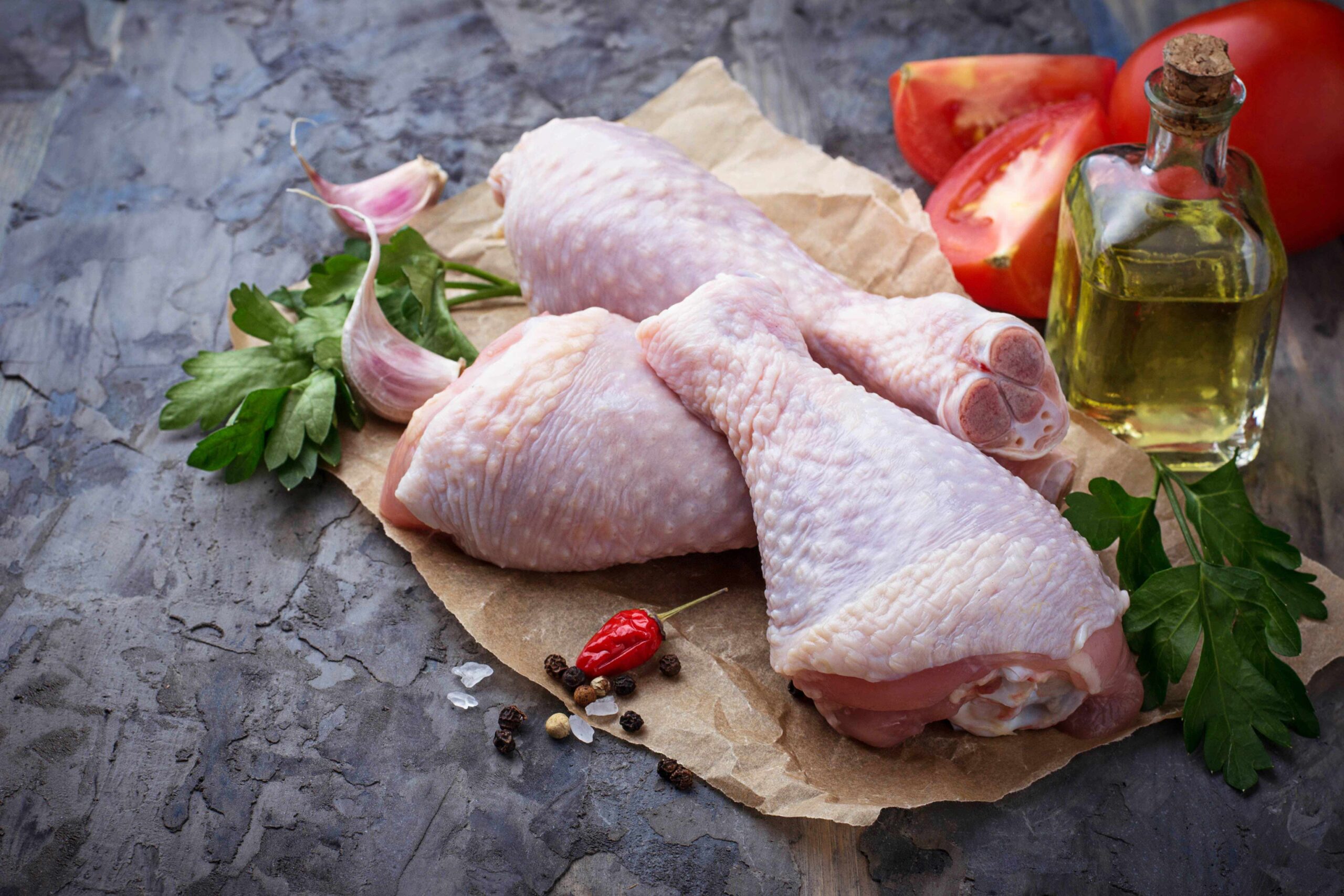 raw-chicken-legs-with-parsley-C6QE5V7