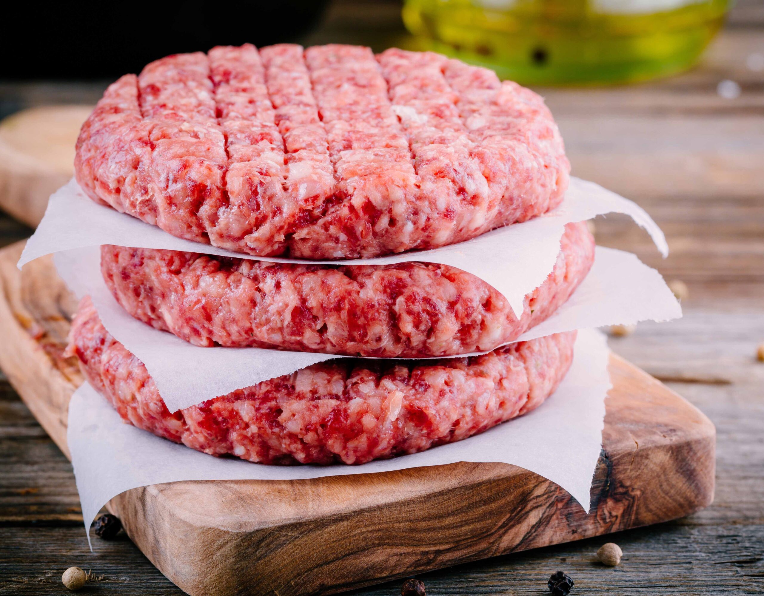 ingredients-for-burgers-raw-minced-beef-cutlets-PE9F95W